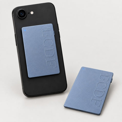 ECDF AI Note Taker: a thin blue-grey card attached to the back of a black phone, and a second card lying flat