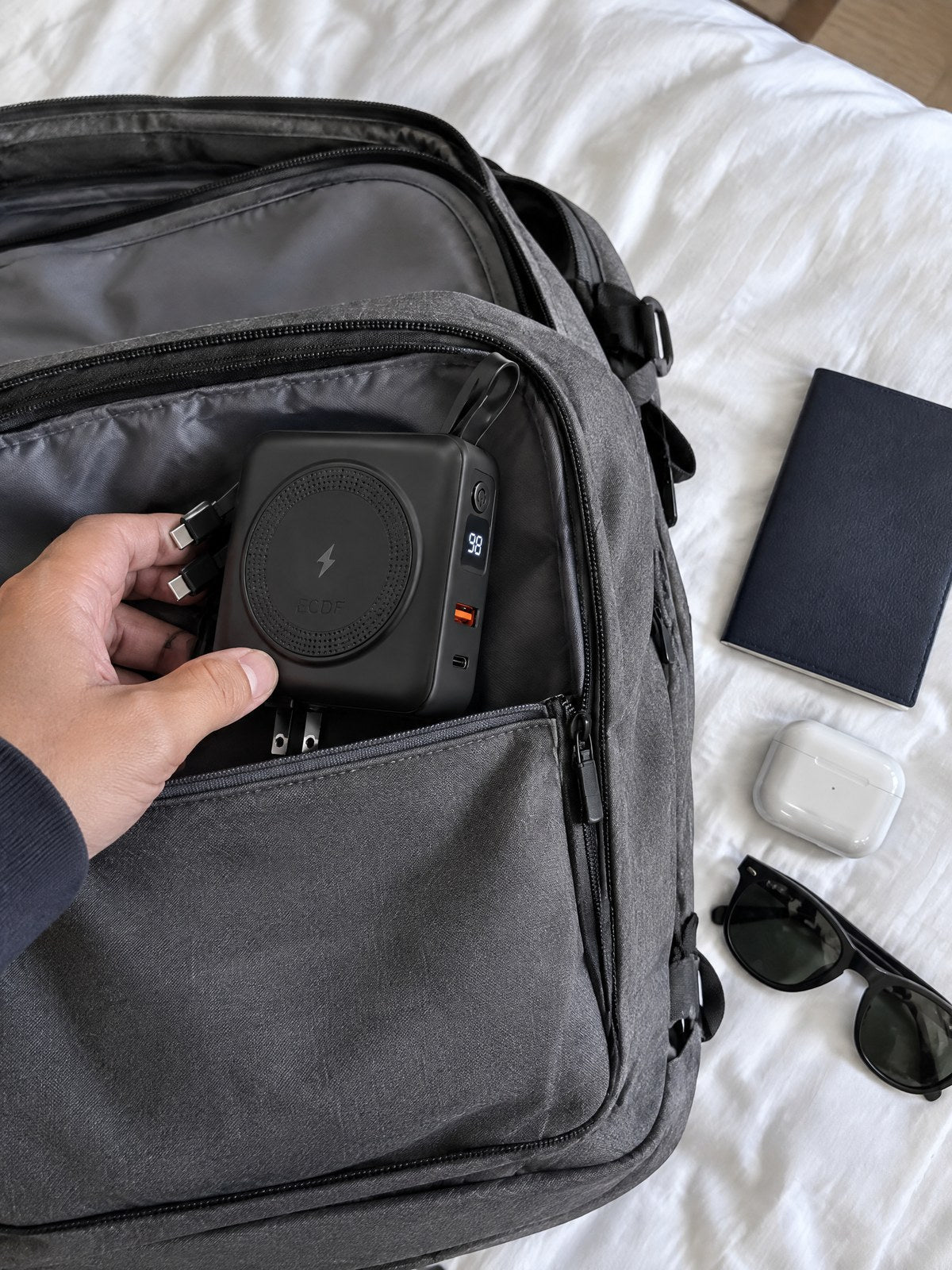 The ECDF power bank in a travel backpack pocket