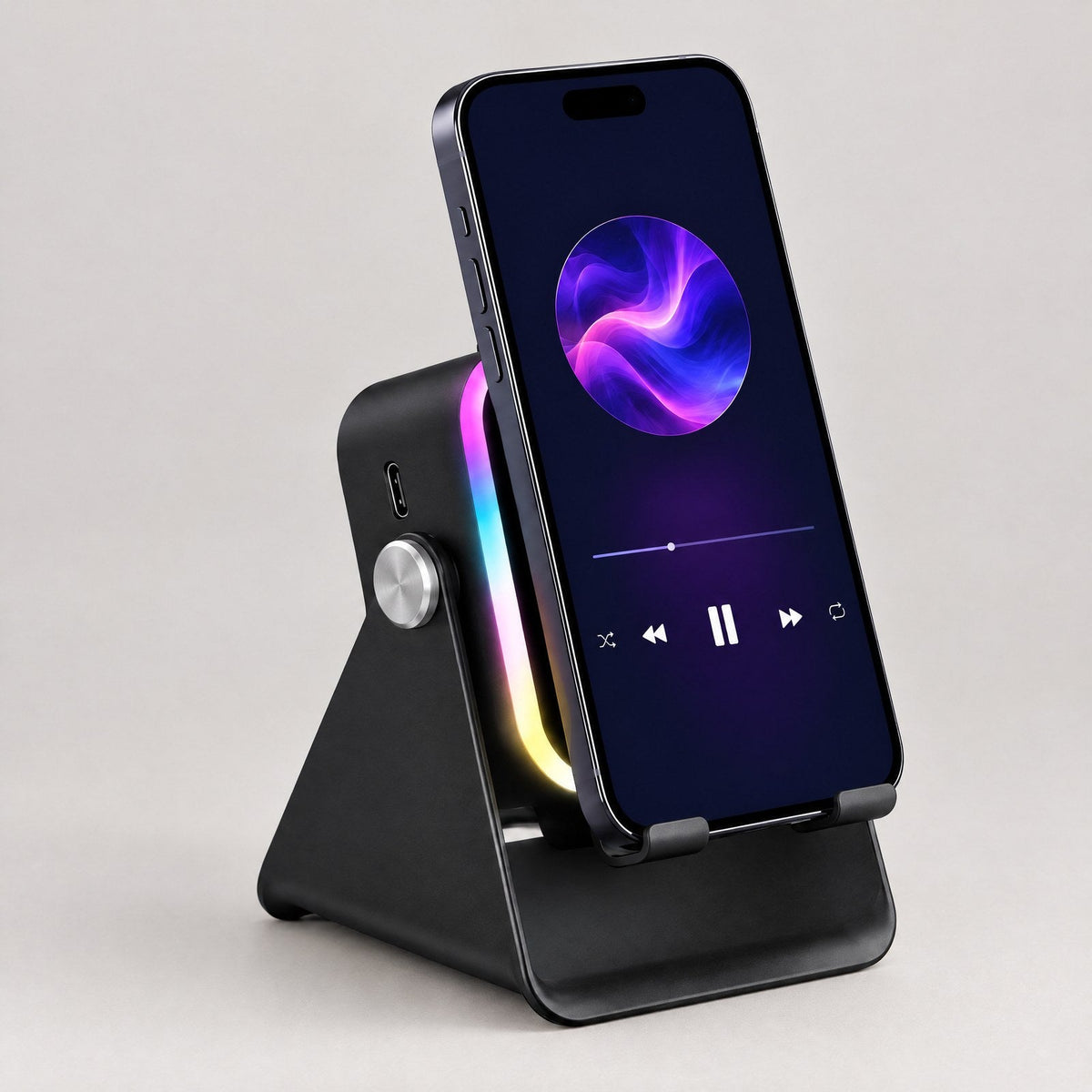 ECDF Induction Speaker Stand: black foldable phone stand with a glowing RGB light arch, silver knob and side USB port, a phone standing on it