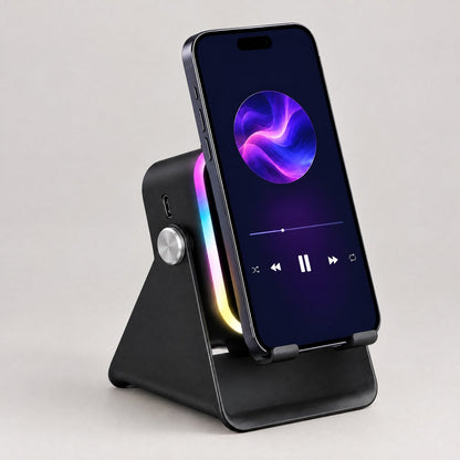 ECDF Induction Speaker Stand: black foldable phone stand with a glowing RGB light arch, silver knob and side USB port, a phone standing on it