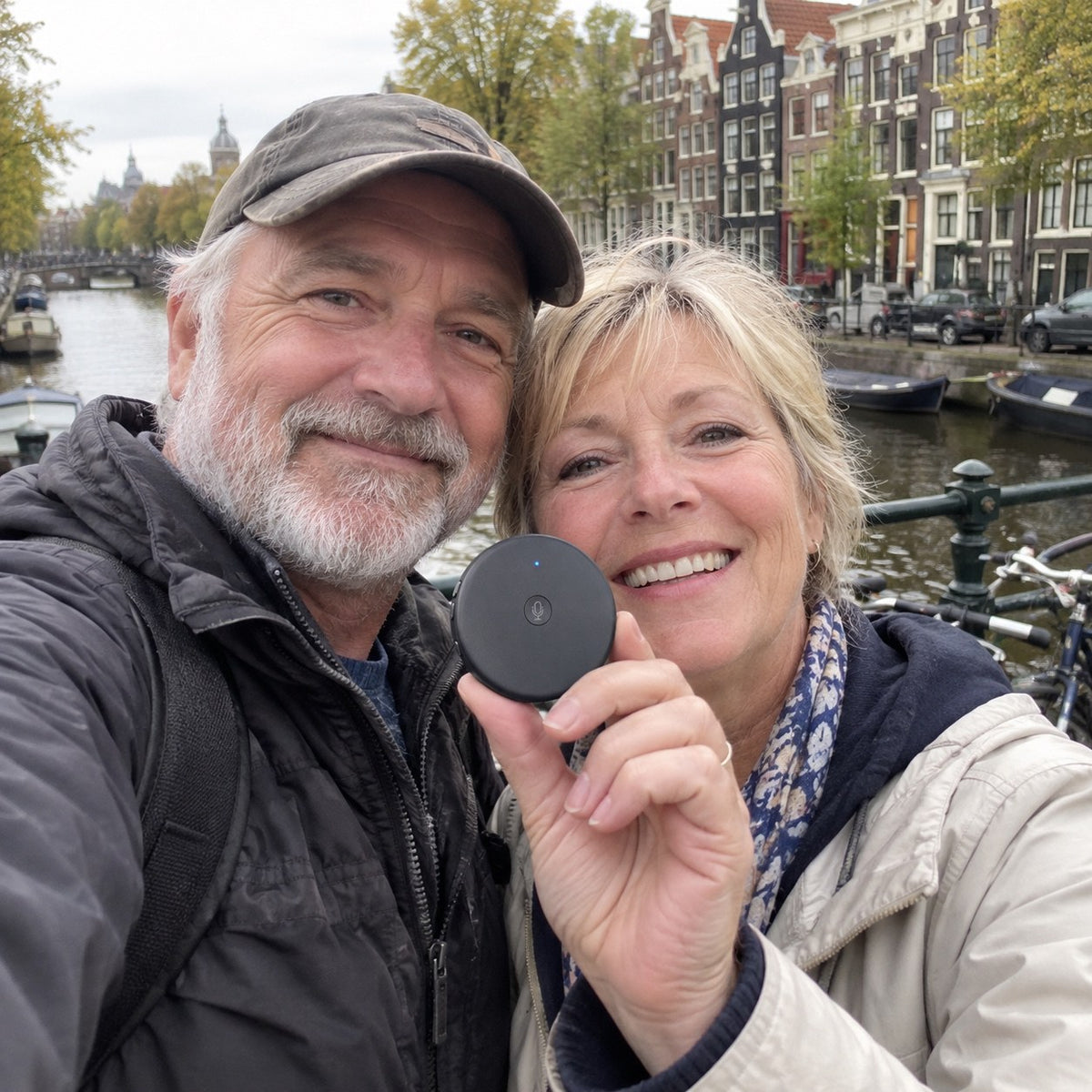 Selfie on an Amsterdam canal bridge: a couple holds up the ECDF translator