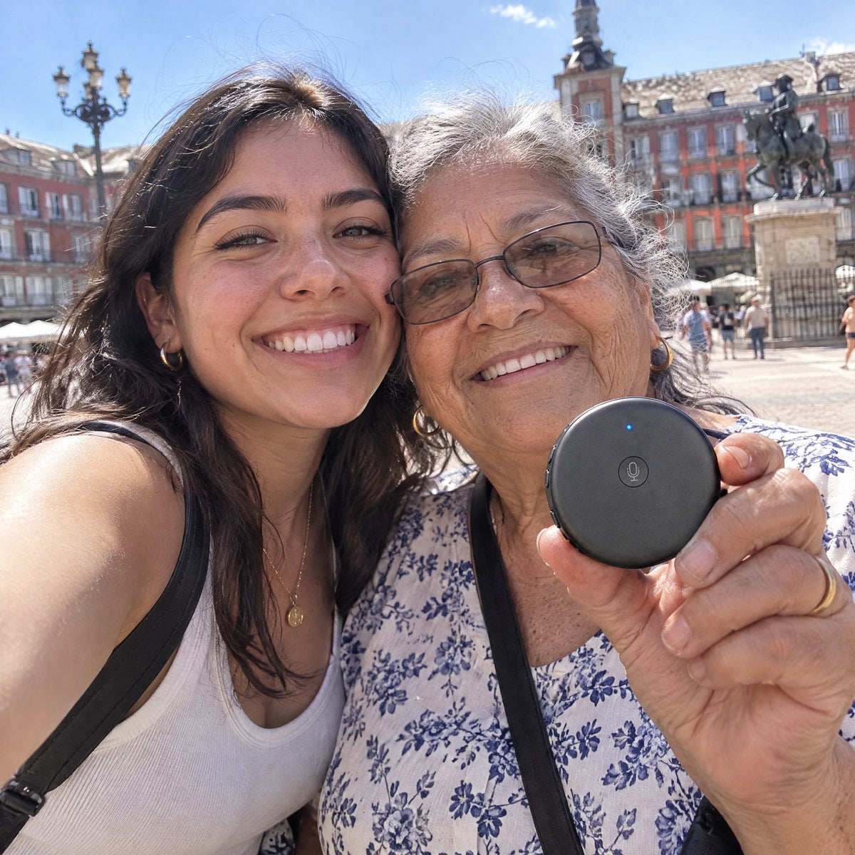 Selfie in Madrid: a grandmother and her granddaughter hold up the ECDF translator on the Plaza Mayor